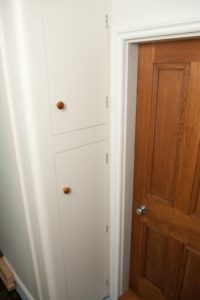 Fitted utilities cupboard with curved edges