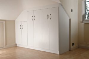 Wardrobe fitted into sloping ceiling