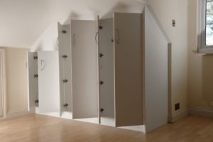 Wardrobe fitted into sloping ceiling