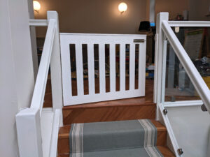 Baby gate and glass balustrade